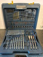 Open drill bit set showing assorted bits in molded tray
