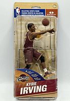 Front view of sealed McFarlane NBA 29 Kyrie Irving Gold Chase figure package