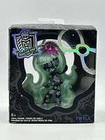 Front view of Twyla vinyl figure inside original Monster High window box