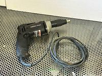 Full view of Porter Cable drywall driver with cord coiled