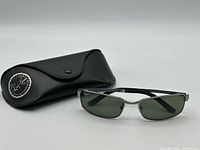 Front view of sunglasses with case