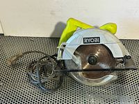 Overall view of Ryobi circular saw showing body, blade, cord