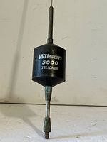 Close-up of base coil showing Wilson 5000 Trucker branding and mounting stud