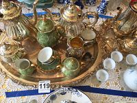 Overview of mixed silver-plated serving sets, porcelain tea set and frosted glass cordial set