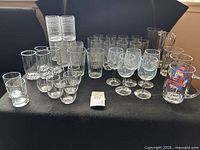 Full lot showing assorted tumblers, goblets and mugs