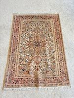 Full view of Persian Tabriz rug showing overall pattern and size