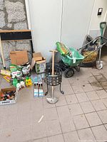 Group view of all garden tools, spreader, shovel, mailbox, stand, bags and boxed sprayer
