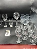 Grouped wine and water glasses on black background