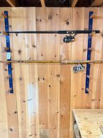 Both rods with reels mounted on wall rack