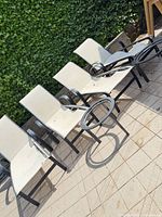 Four chaise lounges on patio