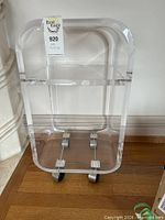 Front view showing full cart, casters, two tiers