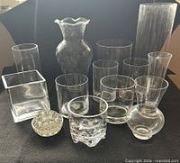Full group of clear glass vases, frog in front