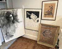 Group view of all four artworks leaning against wall