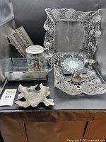 All items in lot grouped together on black background