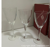 Three different crystal wine glasses on counter