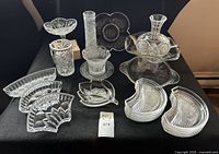 Overview of cut crystal serving pieces, dishes, vase and decanter