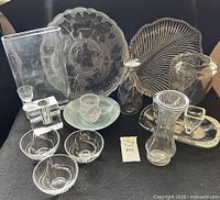 Group shot of all glassware showing platters, bowls, vases and small dishes
