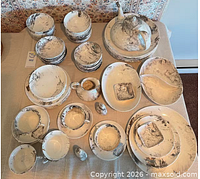 Top-down view of entire 69-piece Surf Ballet dinnerware set