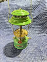Front view of green AFG pressure lantern standing upright