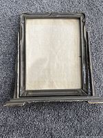 Front view of wooden swivel frame with base