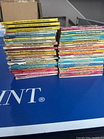 Two stacks of Archie digest comics on table