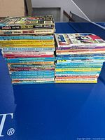 Two stacks of Archie digest comics on table