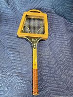 Racket with Dunlop press front view