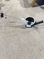 Full view of Cannon manual downrigger with boom, spool, crank handle, and base