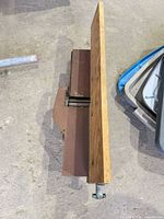 Top view showing wood fence board attached to cast iron base