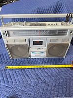 Front view of Clairtone 7977 boombox showing speakers, cassette deck and tuning dial