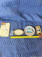 All five items lined up with measuring tape for scale