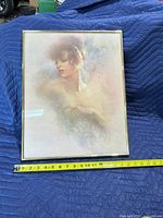 Front view of framed portrait with tape measure for scale