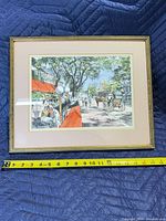 Front view of framed print with measuring tape showing width