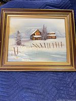 Front view of framed winter landscape oil painting