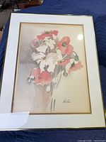 Front view of framed floral print with mat and signature