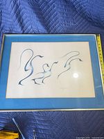 Front view of framed Garry J. Meeches print with tape showing width