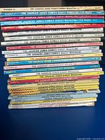 Spine view of 26 issues showing titles and issue numbers