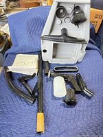 Full lot view on blanket showing caddy and attachments