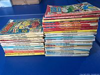 Two stacks of Laugh Comics Digest magazines showing spines and cover tops
