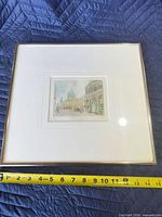 Framed etching with measuring tape for scale