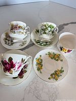 Overall view showing four cups and four saucers