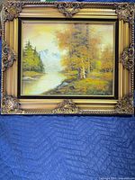 Full view of framed landscape painting