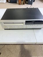 Front view of the VCR showing cassette slot, controls and display