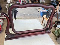 Front view showing serpentine mahogany frame and scroll supports