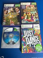 Four Xbox 360 Kinect game titles: three in cases, one loose disc