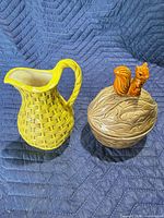 Pitcher and cookie jar side by side showing overall form and colors