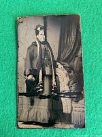 Full view of tintype showing subject and overall condition