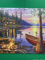 Completed 1000-piece puzzle showing full Canoe Lake artwork
