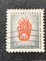 Front view of the 5-cent House on Fire stamp showing design and cancellation