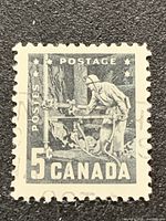 Front view of the 1957 Canada 5-cent Miner with Drill stamp showing design and cancellation